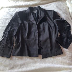 blazer with laser cut floral  design on the sleeves